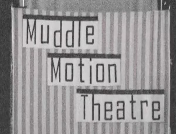 Black and white, grainy image of letters reading "Muddle Motion Theatre"